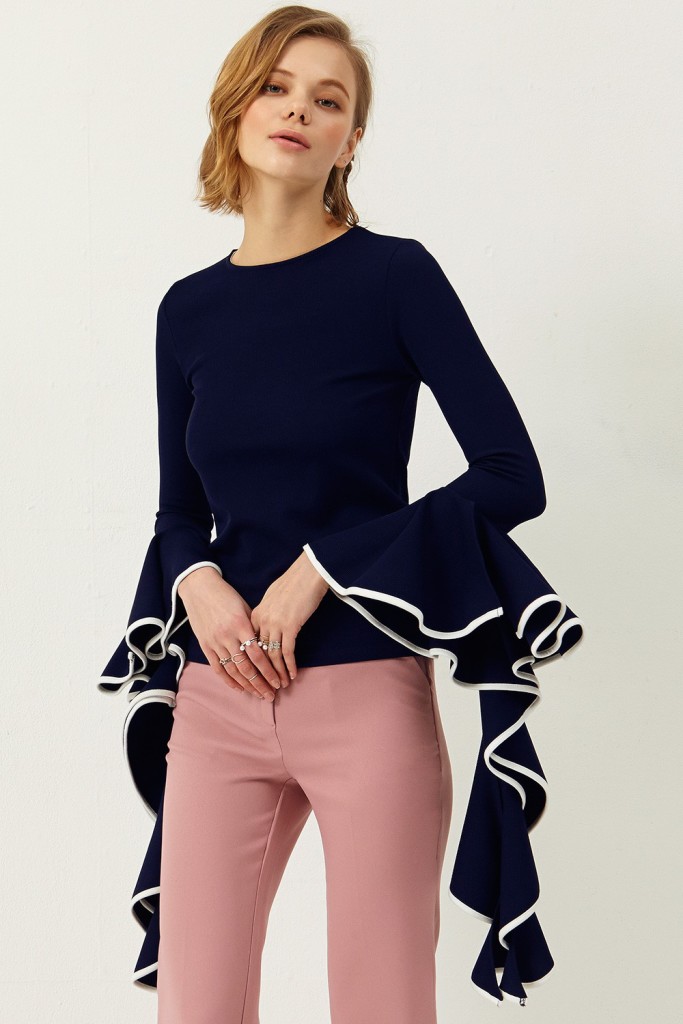 Loving the dramatic, fancy sleeves on this fitted sweater. 